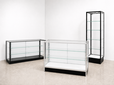 Extra Vision black and aluminum showcases at matching heights with white rear doors in a bright showroom