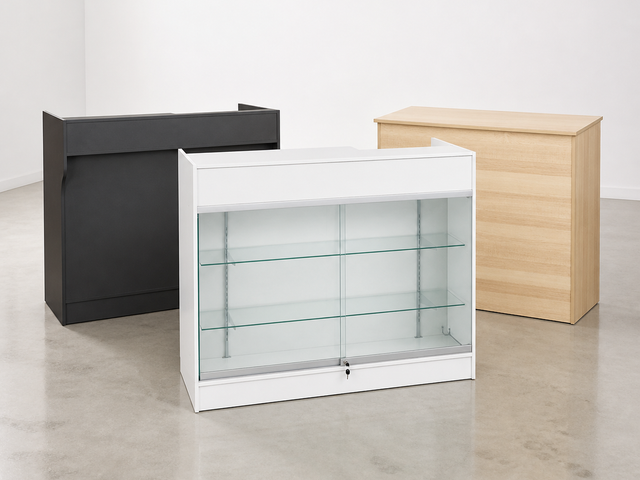 Retail counters arranged in a white showroom with concrete flooring