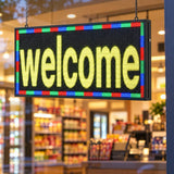 RGB digital banner sign displayed in a storefront window