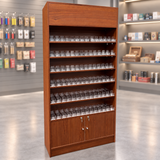 cherry cigarette dispenser wallcase with locking storage doors in a muted smoke shop