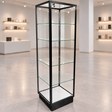 Black Extra Vision Retail Glass Tower Display in a muted retail store