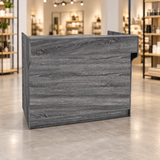 Retail Ledgetop Counter – Rustic Gray, 4 ft, front view in a retail store