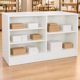 White 70" Retail Wrap Counter back view with plain inventory boxes in a retail store