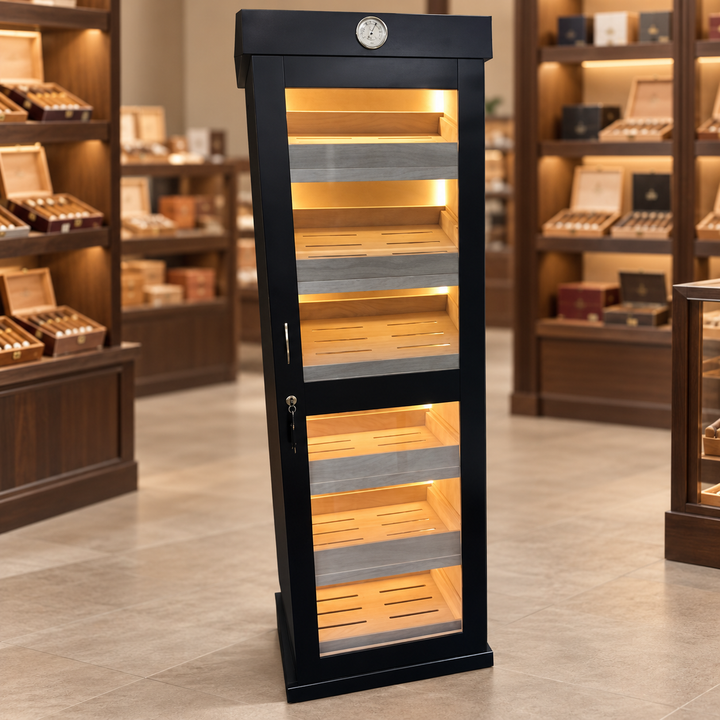 Black single-door humidor with illuminated cedar shelves in a cigar shop